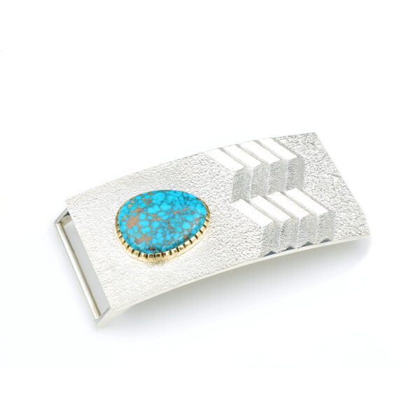 A silver belt buckle with a turquoise inlay