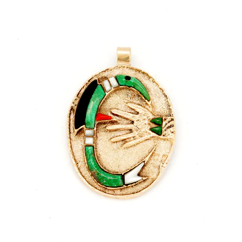 Monongye, Preston  – 14k Gold Tufa Cast Inlaid Parrot Pendant