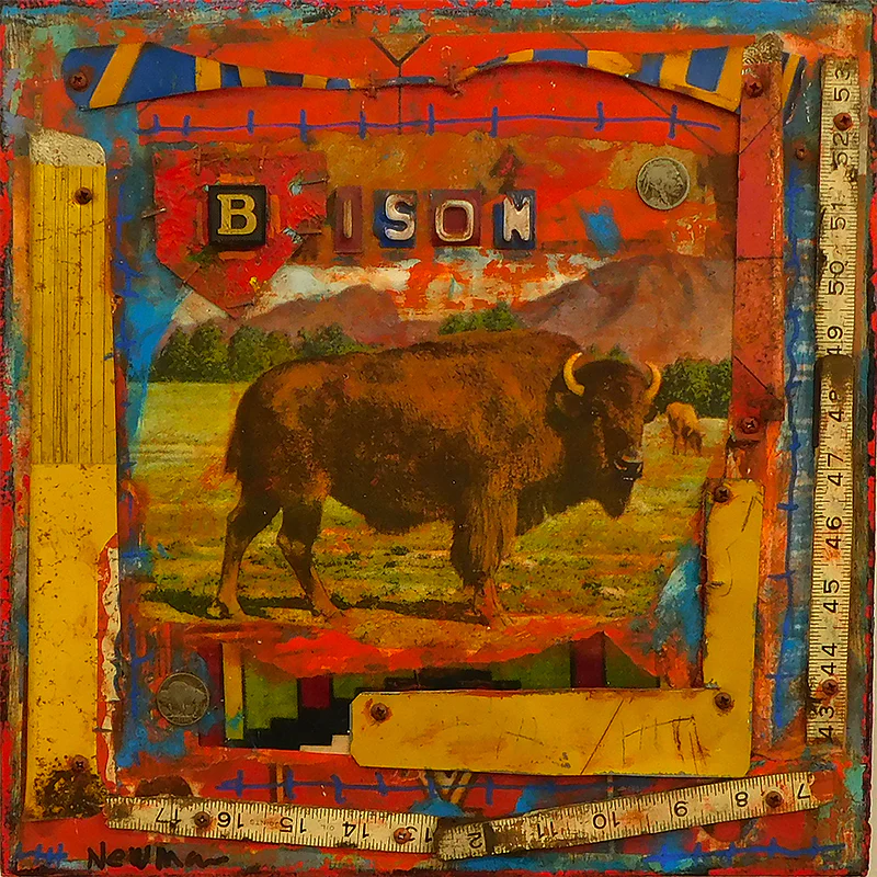 Mixed-media painting of a bison standing in a grassy field with mountains and trees in the background. The central image is framed by bright, weathered collage elements in orange, red, blue, and yellow, including rulers, screws, coins, and painted markings. Letter blocks across the top spell “BISON,” giving the piece a rustic, assembled, folk-art feel.