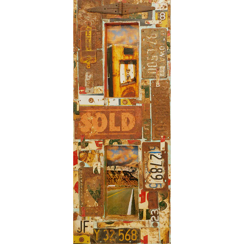 Somewhere Down the Road by Dave Newman is a vertical mixed-media assemblage made from weathered license plates, rusted metal, and found objects. Two inset images—an old yellow gas pump above and an open road leading toward cliffs below—create a nostalgic roadside narrative, while the word “SOLD” and layered automotive fragments add texture, age, and Americana character.