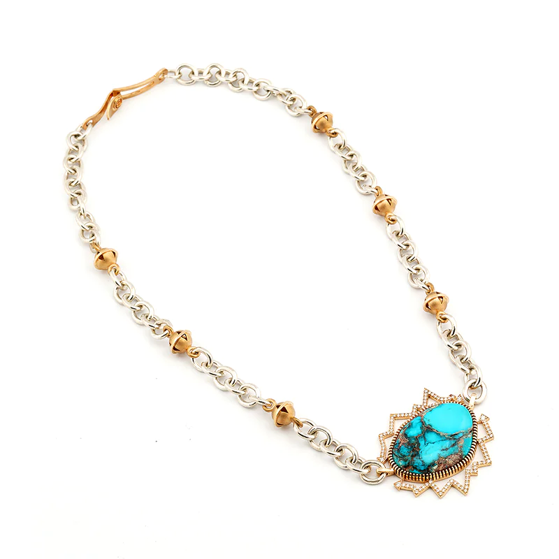 Bo Monongye sterling silver and gold necklace with a large Bisbee turquoise in a diamond-set gold arrow frame