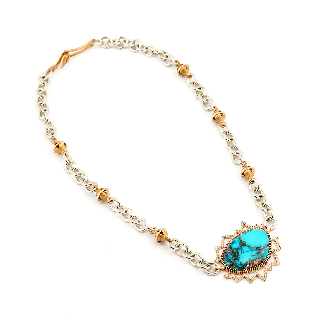 Bo Monongye sterling silver and gold necklace with a large Bisbee turquoise in a diamond-set gold arrow frame