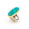 Darryl Dean Begay Lone Mountain turquoise ring with spiderweb matrix in an 18k gold bezel on a tufa cast sterling silver band with carved flower design